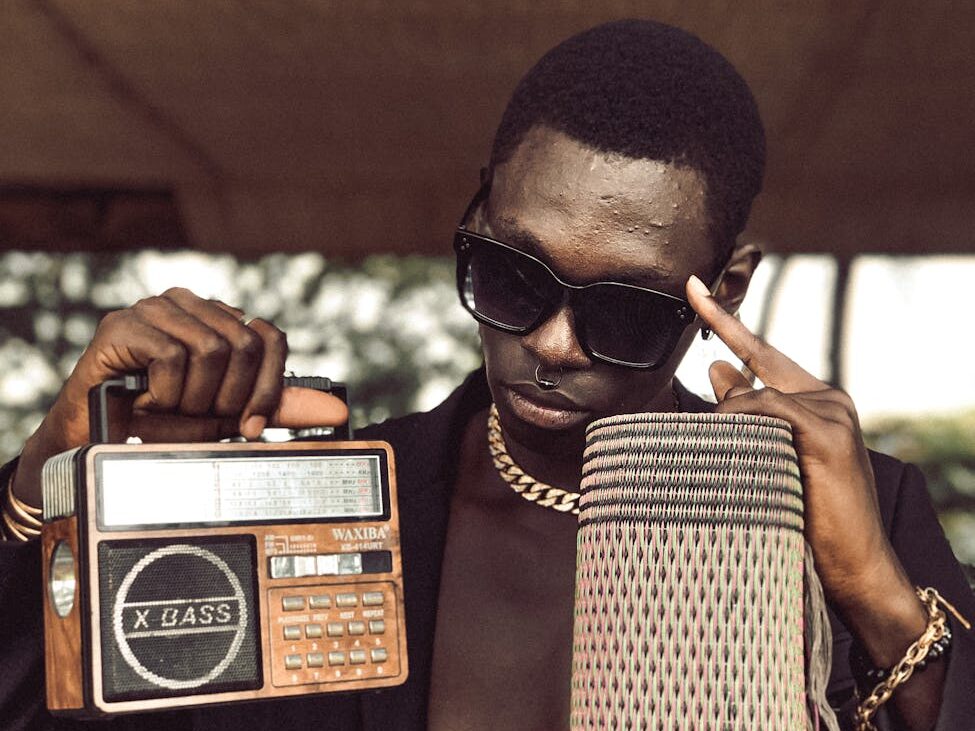 a man holding an old radio