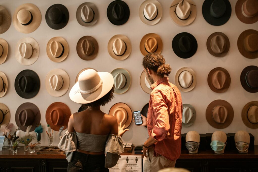 woman in black tube top and white fedora hat