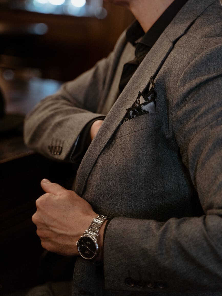 a man in gray suit jacket